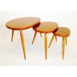 A Ercol 'Pebble' nest of three tables, with elm tops on beech legs 65 cm x 44 cm x 39.5 cm H