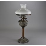 An Edwardian double burner paraffin lamp, with milk glass shade, anthemion pattern to the