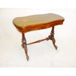 A Victorian walnut fold over card table, on twin pillar supports to porcelain casters 46 cm x 91