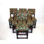 A set of six early 20th century oak Puritan style dining chairs, with tapestry upholstery of hounds,