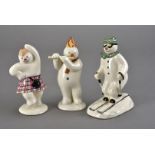 Three Royal Doulton 'Snowman' figures, one as a downhill skier AF, a flautist, and a jigging