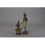 Two Burmese parcel gilt bodhisattva figures, one mahogany mounted in meditative pose balancing on