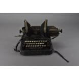 Two Oliver typewriters, and an Imperial typewriter on a wooden base with metal cover having gilt