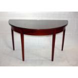 A 19th Century mahogany demi-lune side table, with satin stringing, 129 cm wide x 63 cm deep x 74 cm