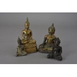 Two gilt bronze south east Asian Buddhas, plus a bronze example; two seated in the Bhumisparsha