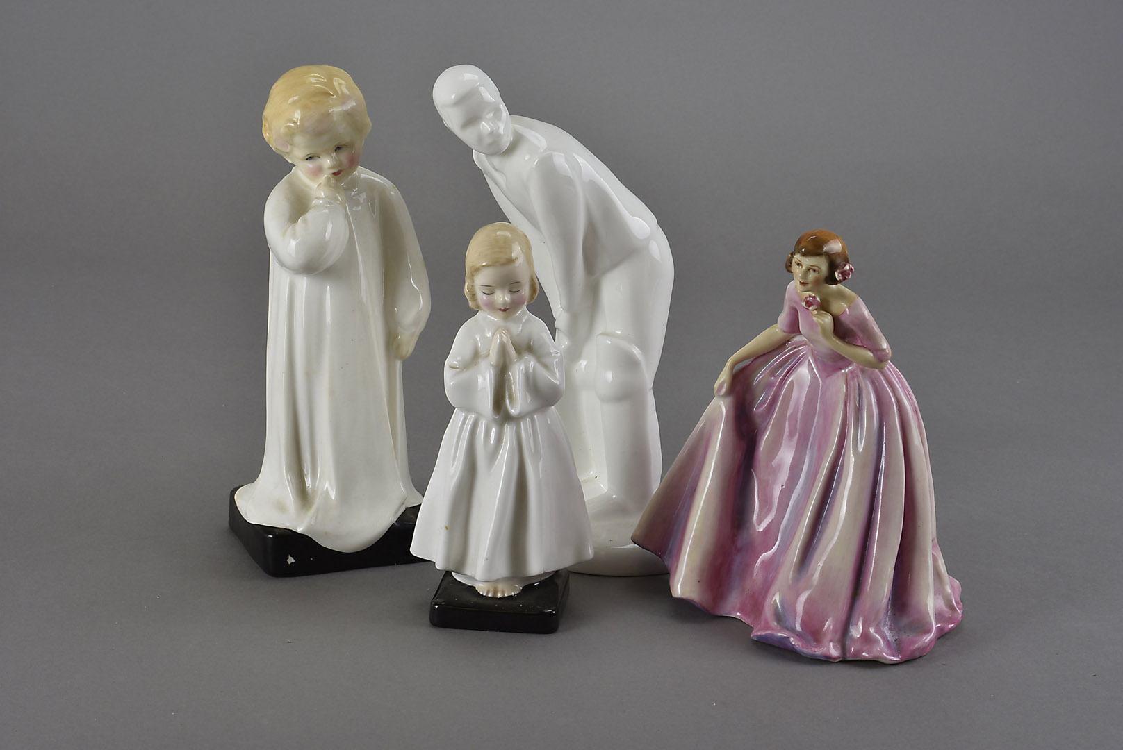 A collection of Royal Doulton figures, including Darling and Bedtime, as well as a Cricketer rom the