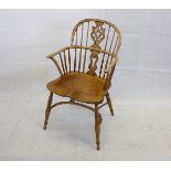 A 19th century two tiered vase splat Windsor country elm and ash arm chair, with oak back splat, and