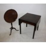 A George III mahogany drop leaf square occasional table, supported on square legs, extended 108 cm x
