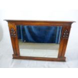 An Arts & Crafts oak overmantle mirror, with relief carved sinew and leaf decoration in the manner