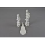 Two graduated slip cast Chinese porcelain Guanyin, plus an Art Deco ivory shoe horn with Guanyin