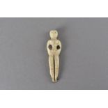 A 19th century American carved bone sewing tool/tooth pick, carved to represent the female form,