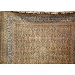 A Prado Keshan style English made large carpet, having central medallion in gold and blue within a