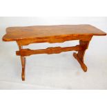 A late 20th century elm refectory table, with hinged top opening to reveal a narrow compartment