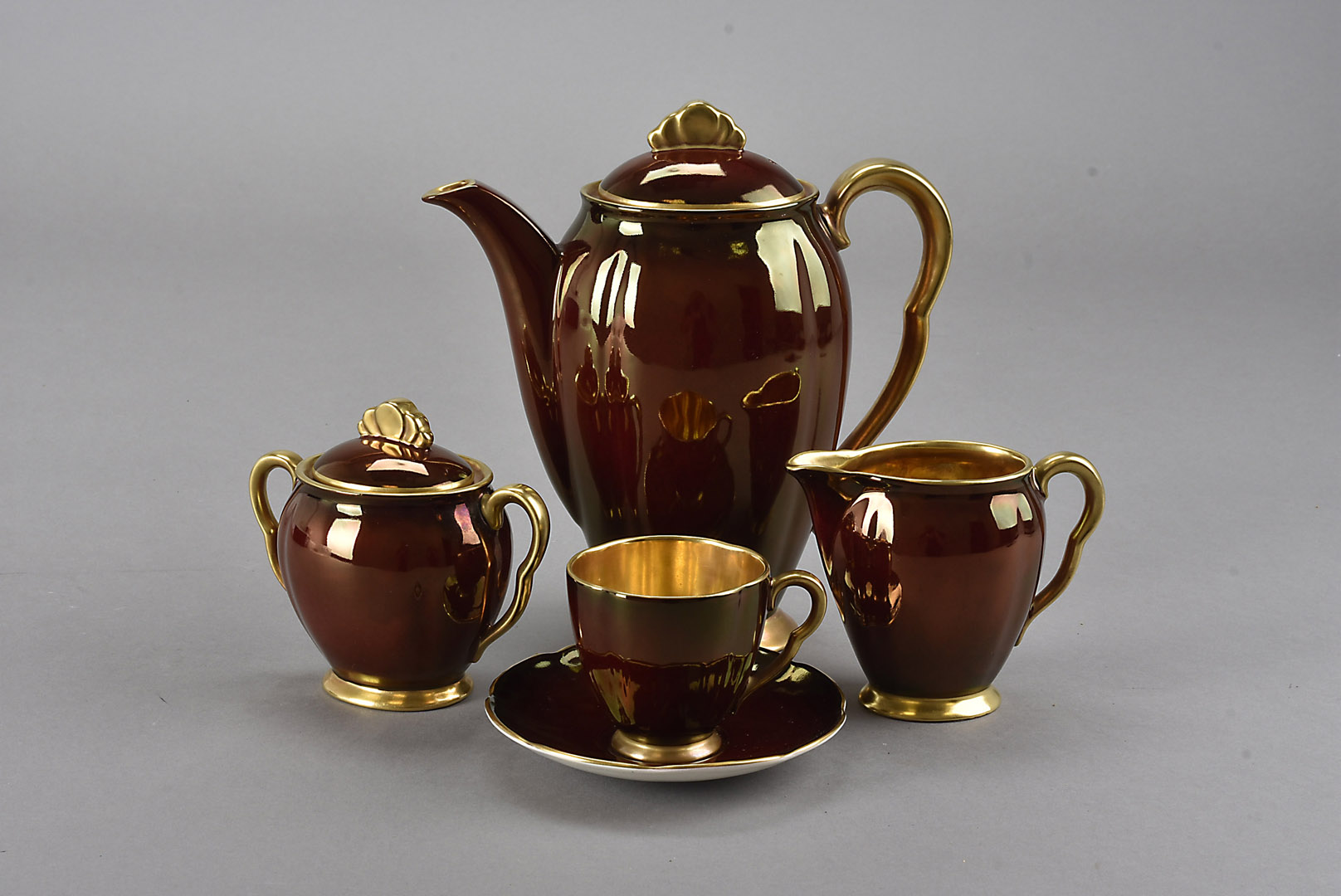 Three Carltonware art deco coffee sets, each comprising coffee pot, cream jug, sugar bowl and six