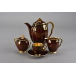 Three Carltonware art deco coffee sets, each comprising coffee pot, cream jug, sugar bowl and six