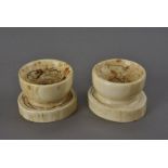 A pair of early 19th century marine ivory trench salts, each with concentric circle marks to the