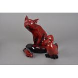 Three pieces of Royal Doulton Flambé ware, including a large seated fox AF, a small stalking fox,