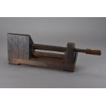 An unusual 19th century wood vice, of triangular form with later tongue for attachment to a bench
