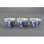 Three Chinese porcelain tea bowls, four character marks to the base 4.5 cm H x 7 cm dia.