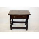 A 19th Century oak low table, with single frieze drawer on turned supports, block feet and legs