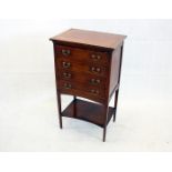 An Edwardian mahogany and satin, boxwood and ebony banded music sheet cabinet, four drawers shaped