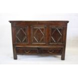 A late 17th early 18th century country oak mull chest, the rectangular hinged top with split above
