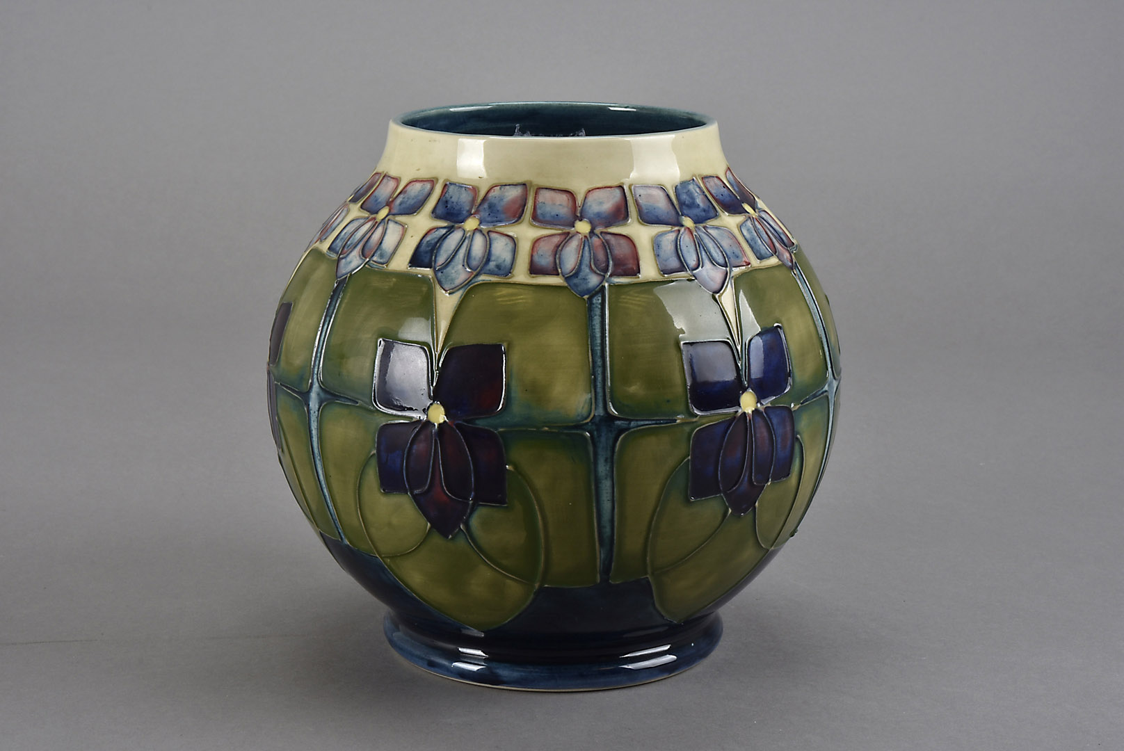 A Moorcroft Pottery vase, of spherical form and decorated in the Glasgow School style with