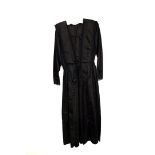 A good quality Edwardian black silk mourning dress, having two tabard shoulder straps with buttons