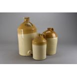 Three two tone stoneware flagons, the largest inscribed Job Wells & Sons Newbury by Price of
