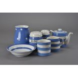 A group of Cornish ware ceramics, including plates, sugar caster, tea pot, flower shaker, jugs, jars