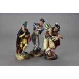 Three Royal Doulton figure groups, The Hornpipe HN 2161 AF, The Pied Piper HN 2102 AF, and The