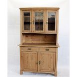 A Continental pine dresser case and top, the base with panel doors and a pair of frieze drawers