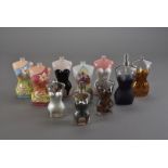 A large collection of Jean Paul Gaultier empty scent bottles, of many different styles, sizes and