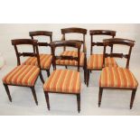 A set of five Regency dining chairs and a matching carver, having curved back rails, carved back