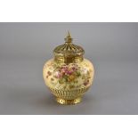 A Royal Worcester blush ivory pot pourri, of ovoid form with floral spray above a basket style