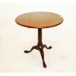 A 19th century mahogany snap top table, on gun barrel tripartite pedestal base 67 cm dia. x 68.5