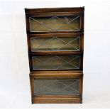 A Globe Wernicke style oak and lead glazed bookcase, made by the Craft Council, bearing stamps to