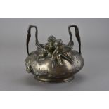 An art nouveau pewter twin handled figural bowl, the projecting twin handles and the oval body