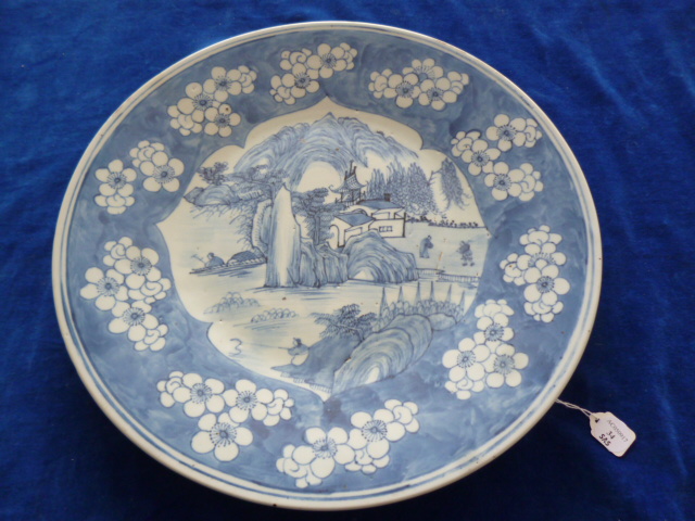 A 19th century Chinese porcelain charger, decorated with figural lakeside landscape within a - Image 3 of 4