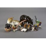 A collection of ceramic ornaments, including a Hutschenreuther golden pheasant, butterfly, brown