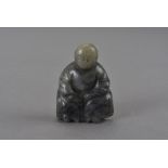 A Qing dynasty grey nephrite Buddha figure, possibly part of a larger group 6 cm H