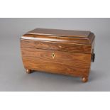 A 19th century Macassar ebony tea caddy, fitted with the original twin tea compartments and sugar