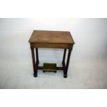 A regency walnut veneered four column console table, with hinged top to reveal a fitted interior and