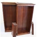 A pair of modern mahogany veneered bookcases, of rectangular shape, supported on plinth bases,