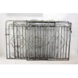 A pair of Art Deco style wrought iron gates, with scroll design, painted in silver 132 cm wide X 123