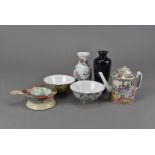 A collection of oriental porcelain, including a Japanese porcelain tea strainer on stand, a