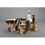 A collection of Bells Whiskey bell shaped decanters, including five in original tubular packaging,