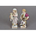 A pair of vintage Meissen porcelain figures, both with restorations, modelled as a boy with sheep