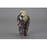 A Jonathon Cox tube lined vase, of baluster form and decorated with foxgloves, signed to the base