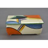 A Clarice Cliff style Art Deco ceramic box and cover, having brightly coloured decoration, marked